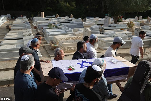 Family and friends carry Shani's coffin at her funeral last night