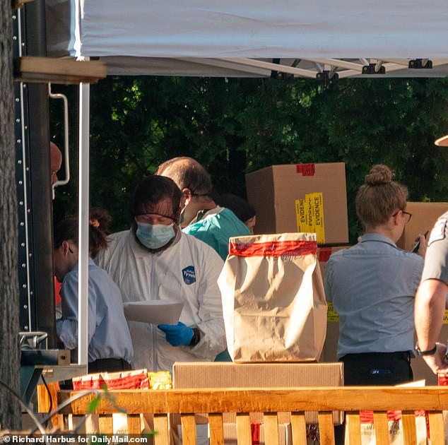 The Suffolk County District Attorney's Office declined to comment on the nature of the new search.  Pictured: Investigators set up outside Heuermann's home last July