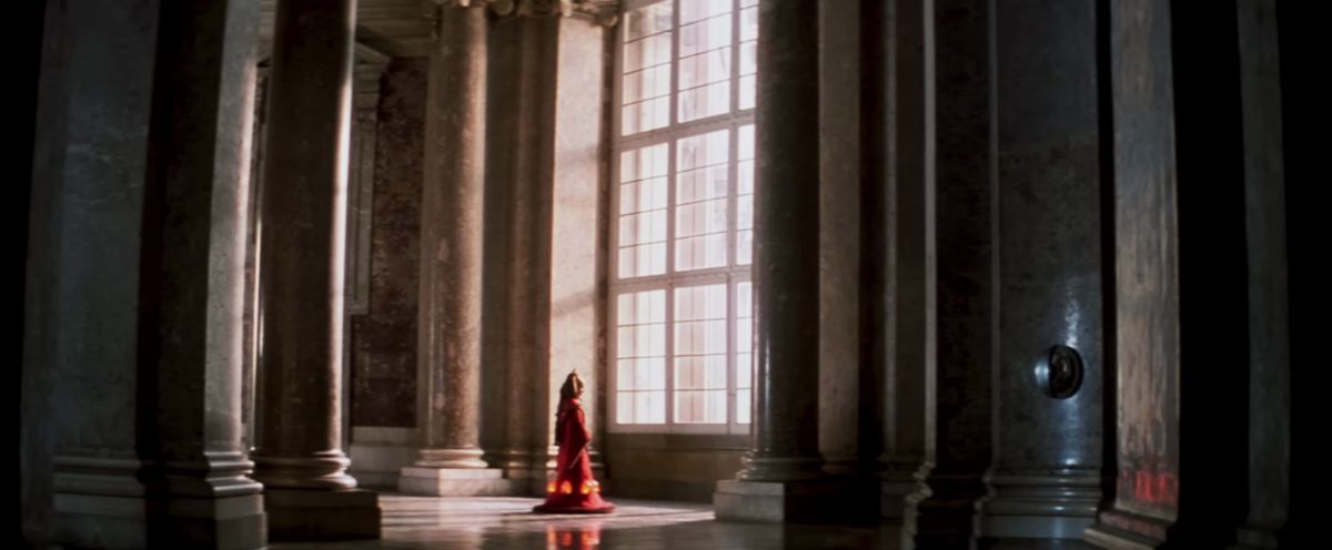 Padme in her royal attire looks out a giant window in her Naboo palace in Star Wars: The Phantom Menace