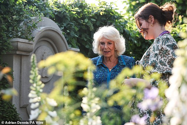 Camilla is pictured in the Bridgerton garden.  She revealed that she has been watching the Netflix show of the same name