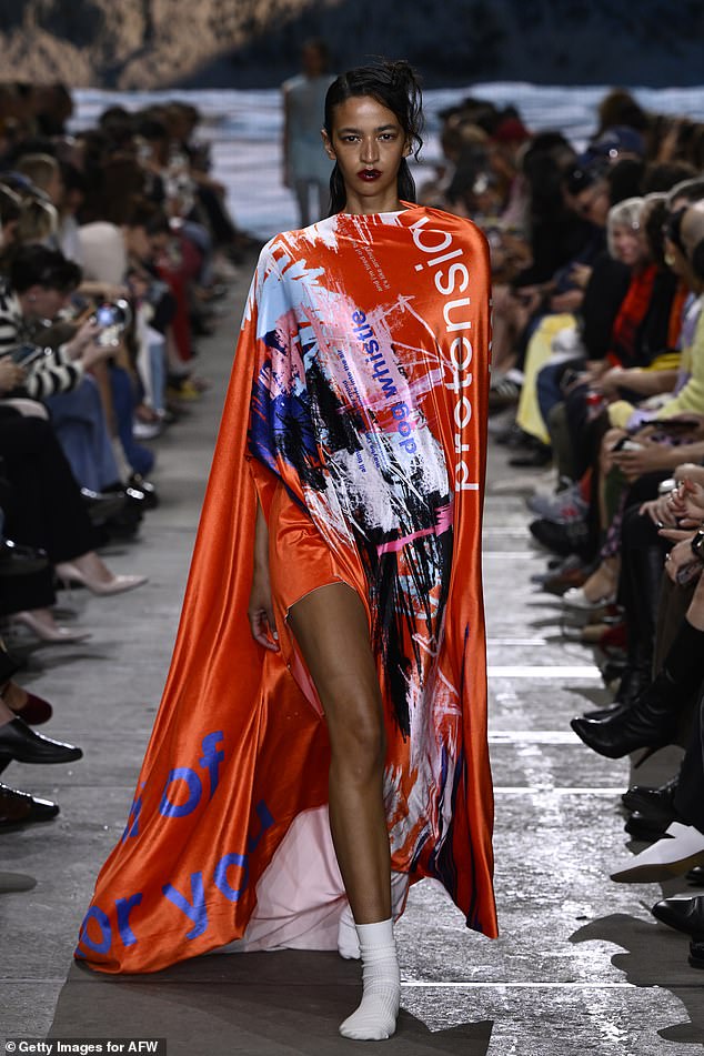 Pictured: A model walking the catwalk during Australian Fashion Week 2024