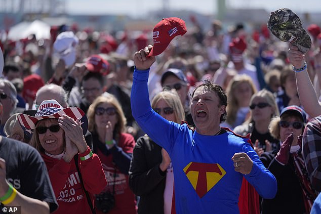 Supporters of former President Donald Trump cheer during the playing of the national anthem before his performance Saturday in Wildwood