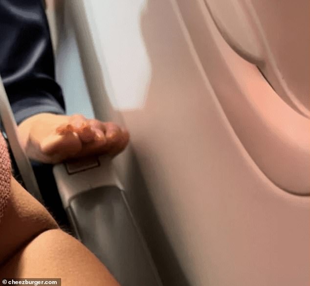 Teen no!  A mother traveling with her young daughter was shocked to see a man's bare feet on her armrest during a flight