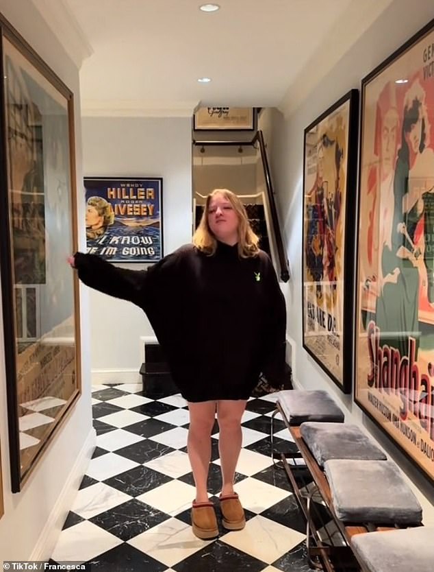 Francesca Scorsese is directed by her father as she walks down a hallway filled with movie posters