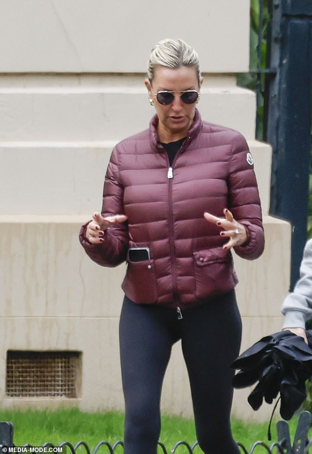 Tania added black leggings and white sneakers, while wearing sunglasses