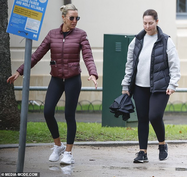 The former wife of AFL legend Nathan Buckley, 51, was spotted at a karting event with her arm around Marco