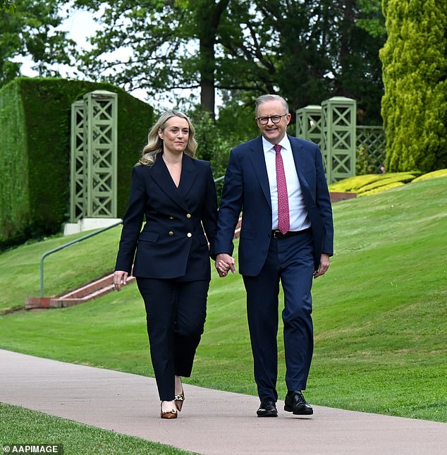 Ms Rinehart said cutting fuel duty would be better than collecting and redistributing the extra tax, such as Anthony Albanese's (pictured with Jodie Haydon) $300 electricity rebate.