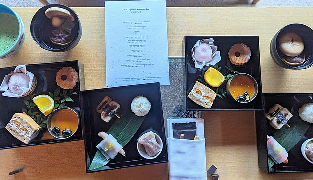 Afternoon tea is beautifully presented in bento boxes in the Fuju lounge