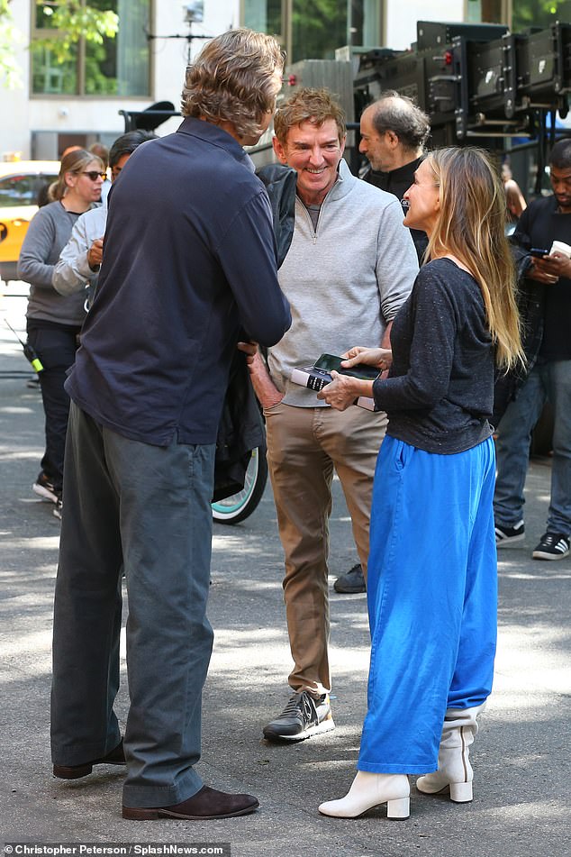 Parker had put on a cozy charcoal sweater, blue sweatpants and a pair of white boots