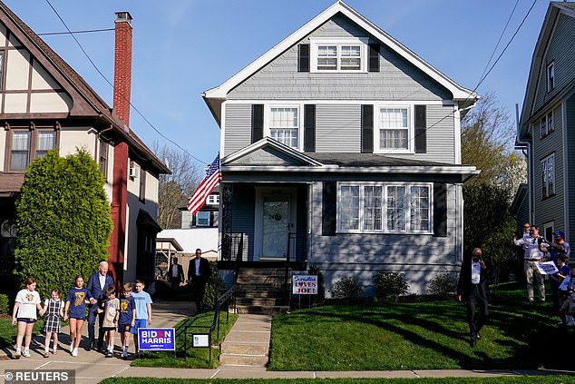 US President Joe Biden walks with children outside his family home during a visit to Scranton, Pennsylvania, US, April 16, 2024