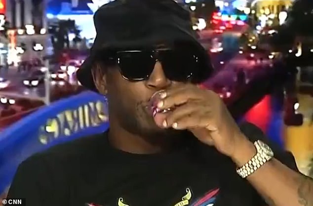 Cam'ron, real name Cameron Giles, was invited to speak on NewsNight to talk about the shocking clip but wondered out loud why he was booked after taking a shot of sex drink