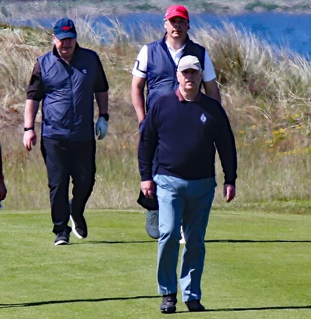 Andrew was shooting with two other golfers on the course this morning.  The Duke of York was seen wearing a navy blue jumper with a gray baseball cap