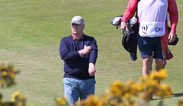 The Duke of York pictured himself rolling up his sleeves today as the sun shone on the golf course