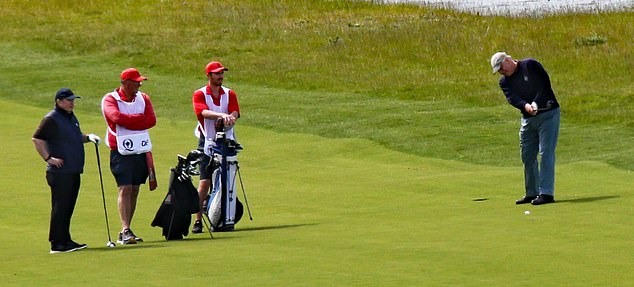 Andrew was joined by three other players on the course's picturesque grounds, while four men, dressed in red with white vests and red caps, caddied for the foursome.