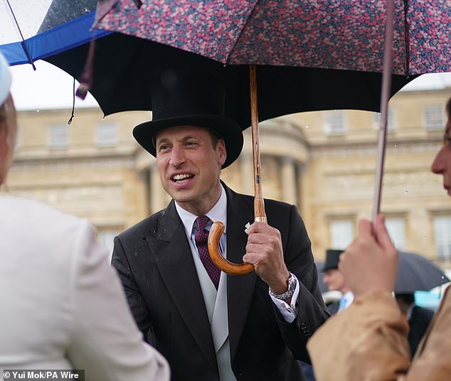 Prince William didn't let the weather spoil his fun at Buckingham Palace