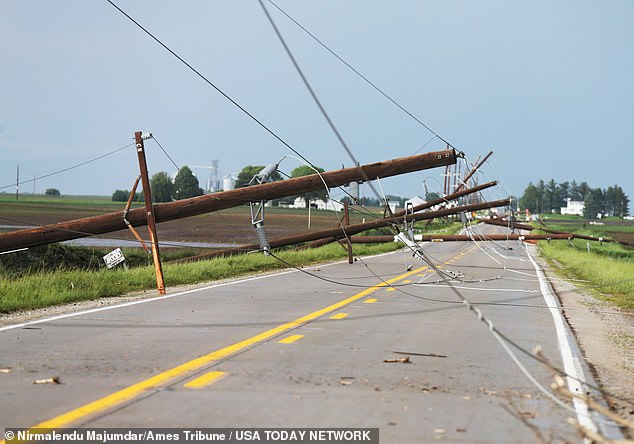 Power lines were downed across the state (pictured in Nevada, Iowa), leaving tens of thousands of people without power