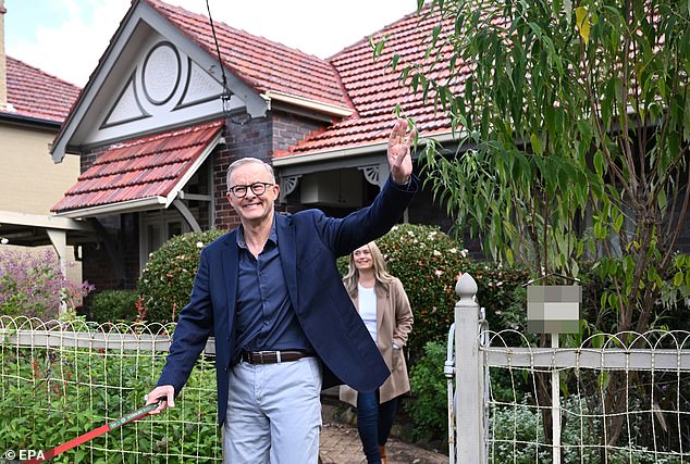 Anthony Albanese and fiancée Jodie Haydon outside his home in Marrickville.