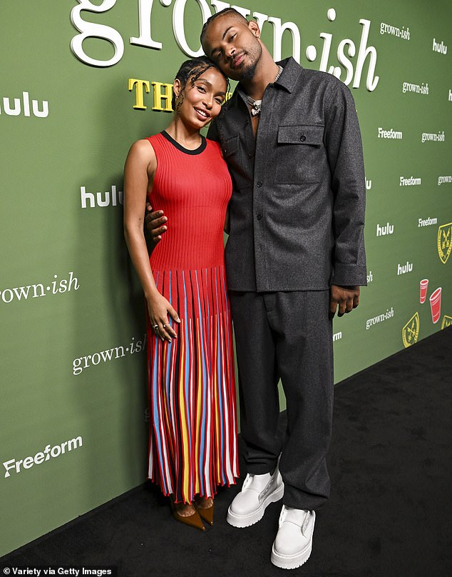 The artist was also pictured with Trevor Jackson, who contrasted a dark gray button-up shirt and matching pants with bright white sneakers.