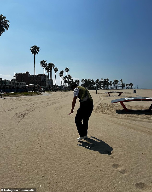 Tom posted a photo of him walking along a deserted sandy beach in the sunshine