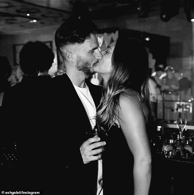 Ash was spotted making love with a mystery woman (right) at the Grand Prix afterparty in Melbourne in March