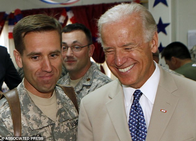 Joe Biden has said he believes there could be a link to the burn pits where Beau Biden was stationed near Iraq and his brain cancer, Beau died in 2015 - over then-Vice President Joe Biden with Beau Biden in Iraq in July 2009