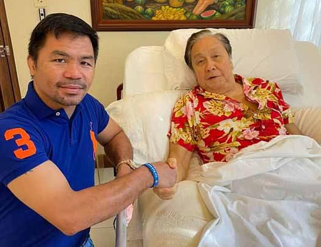 Atienza's grandfather, Lito, pictured with his presidential running mate Manny Pacquaio, perhaps the Philippines' most famous person
