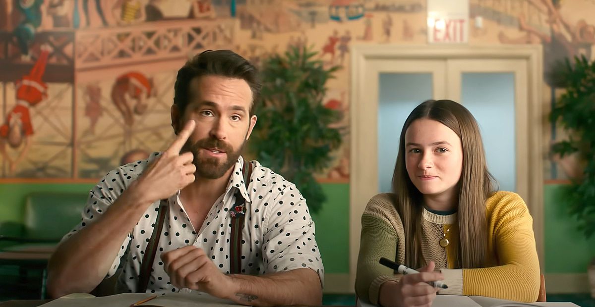 Cal (Ryan Reynolds) and Bea (Cailey Fleming) sit together at a table to interview various imaginary friends in John Kraskinski's IF
