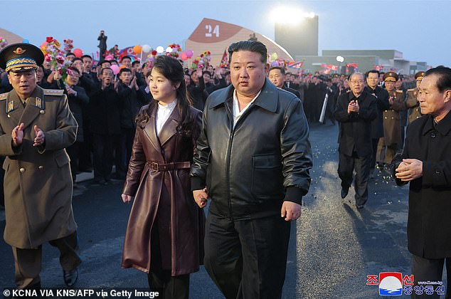 This photo, taken on March 15, 2024 and released by North Korea's official Korean Central News Agency (KCNA) on March 16, shows North Korean leader Kim Jong Un (center R) and his daughter Ju Ae (center L) attending the completion and commissioning ceremony for the Gangdong Comprehensive Greenhouse in Pyongyang