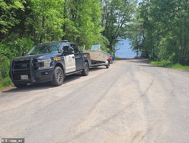 Charges have yet to be filed as an investigation by the Ontario Provincial Police (pictured at the scene) is ongoing