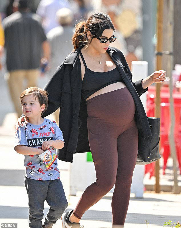 For her outing with her four-year-old son, the actress, 43, showed off her growing baby bump in form-fitting workout clothes and a gray fleece jacket.