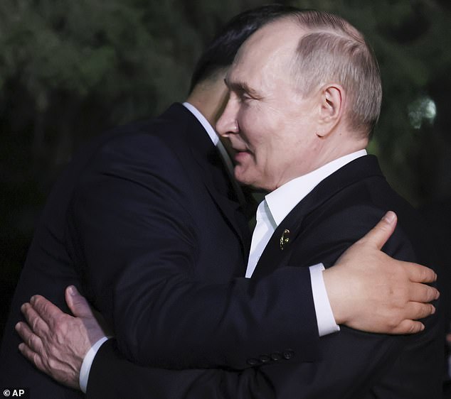 Chinese President Xi Jinping, left, and Russian President Vladimir Putin embrace after an informal meeting in Beijing, China, on Thursday, May 16, 2024