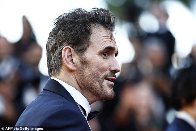 His hair looked grayer at the back when he wore a tuxedo in Cannes on Tuesday