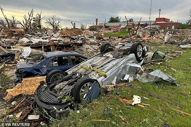 Homes and cars were damaged outside the Adair County Health System hospital in Greenfield