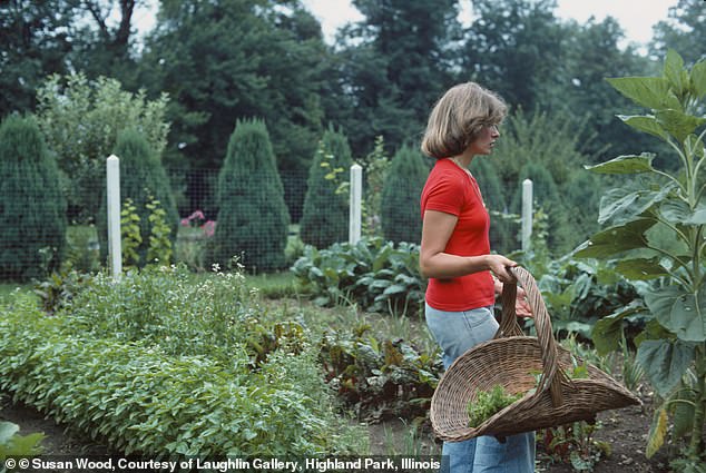 Martha Stewart was seen showing off her green thumb outside as she donned a simple look in which she wears jeans and a T-shirt
