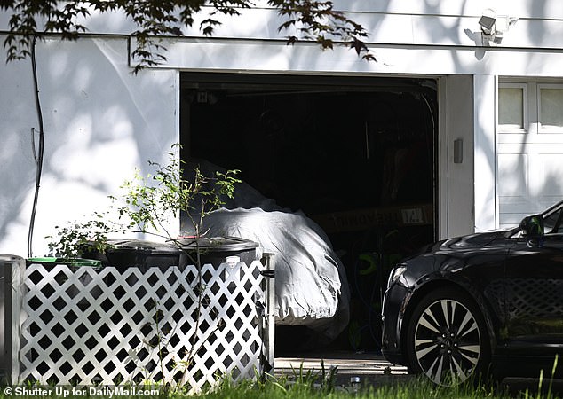 After entering his garage code, the senator walked into his home and disappeared from view
