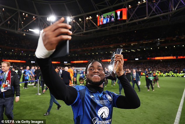 Lookman poses with his player of the match award after becoming the first ever player to score a hat-trick in the Europa League final