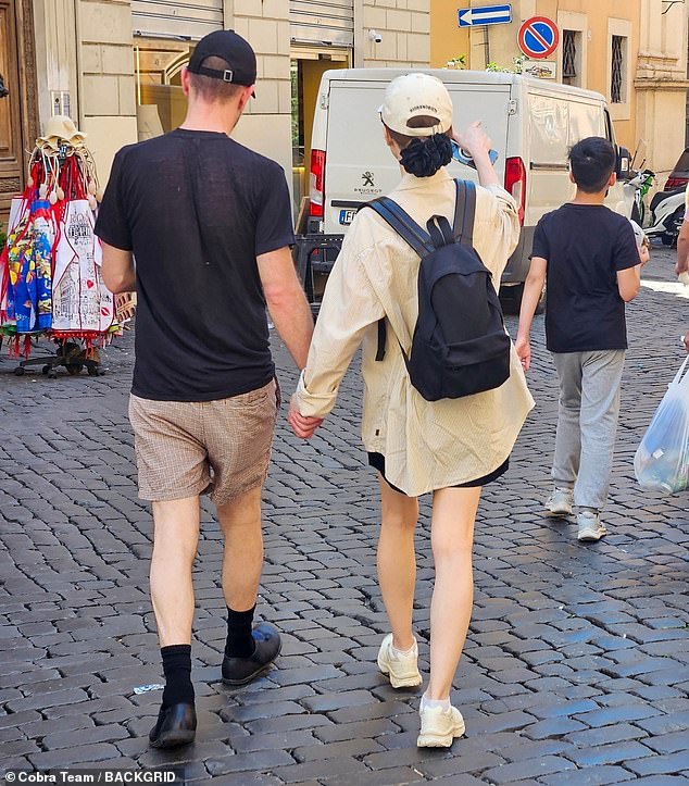 The pair put on a fun display as they strolled through the backstreets of Rome together