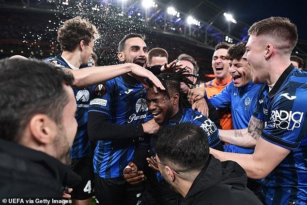 Lookman was mobbed by his Atalanta teammates after lifting the club's first European trophy