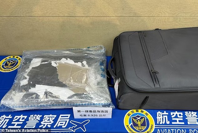 Authorities reportedly found 7kg of cocaine and heroin in her luggage (photo)