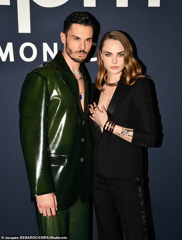 Cara posed next to French model and singer Baptiste Giabiconi