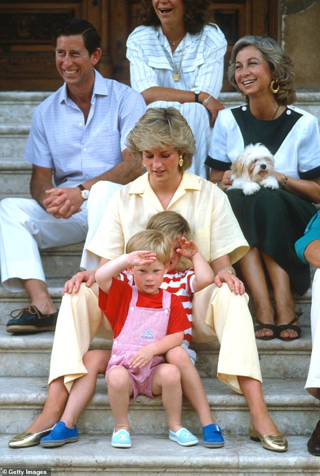 Diana wears a yellow jumpsuit and focuses all her attention on Princes William and Harry while on holiday in Palma, Mallorca, in 1987.