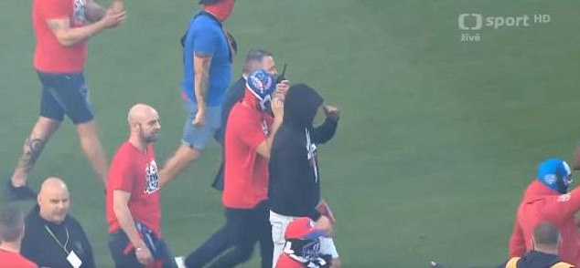 Disorderly fans on both sides wore hoods and balaclavas in an attempt to hide their faces