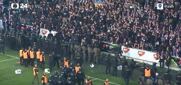 Riot police lined up the stands to protect fans – and prevent more fans from flooding onto the pitch