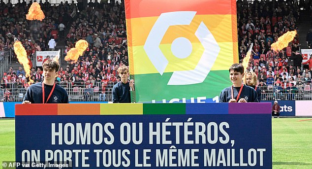The player refused to stand in front of a banner and covered pro-LGBTQ+ signs on his kit (the banner reads: 'homosexual or heterosexual, we all wear the same jersey')