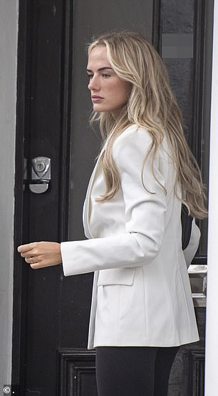 The model looked pensive as she left a building in London