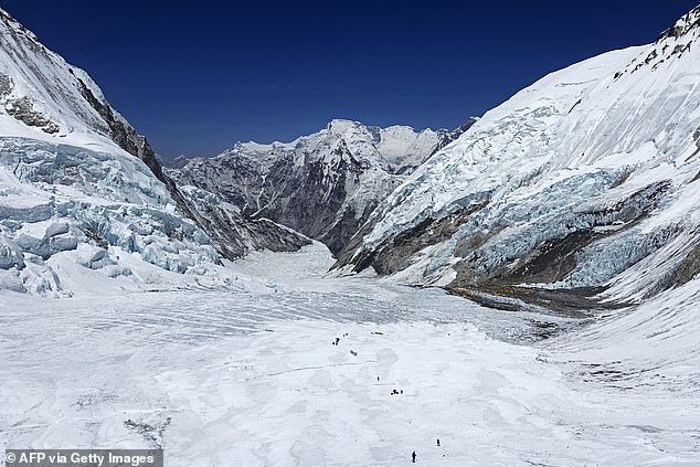 This photo, taken on May 3, 2024, shows mountain climbers on the Khumbu Glacier as they climb to the summit of Mount Everest in Nepal