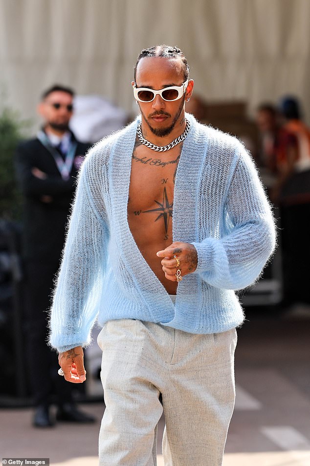 The Formula 1 star, who is known for his quirky fashion sense, confidently showed off his washboard abs in the see-through garment