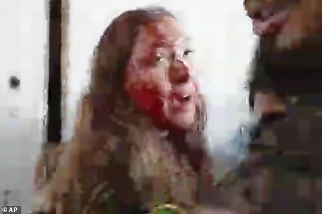 This image, taken from a video from the Hostage Families Forum, shows a bloodied Israeli female soldier from the Nahal Oz military base after she was captured by Hamas on October 7.
