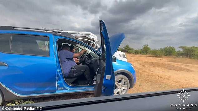 Richard used his car to stop the lions while another motorist started the stranded vehicle