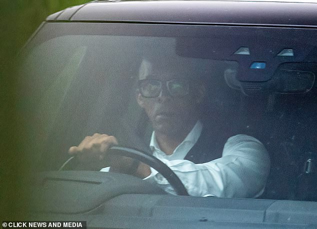 The TV star was not wearing his wedding ring as he headed out in his black Land Rover Range Rover
